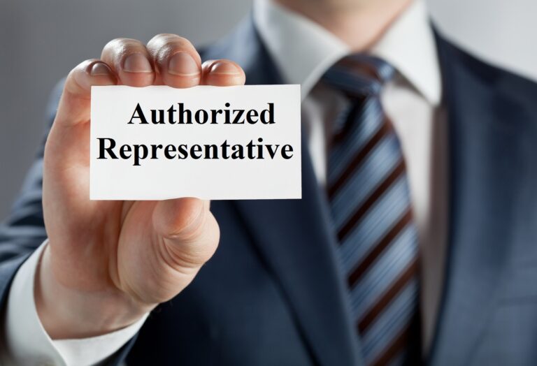 Closeup of young man's hand showing blank badge